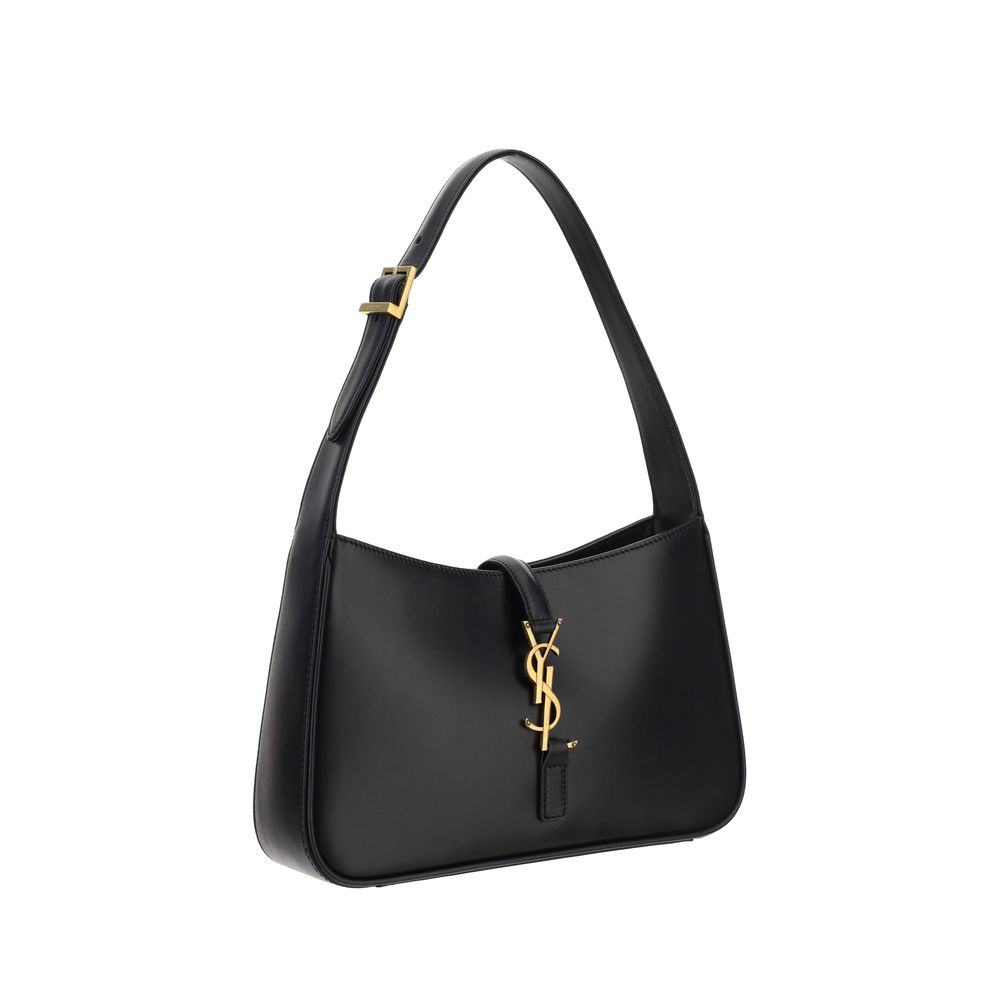 Black Calf Leather Bos Taurus Shoulder BagThe Leather Hobo Shoulder Bag by Saint Laurent is an essential and refined model made of smooth leather with an elegant finish. Featuring a single adjustable top handle with buckle, it is distinguished by the inte