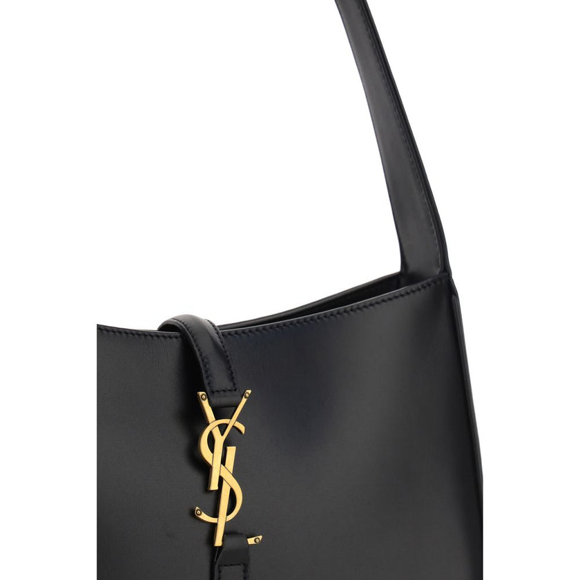 Black Calf Leather Bos Taurus Shoulder BagThe Leather Hobo Shoulder Bag by Saint Laurent is an essential and refined model made of smooth leather with an elegant finish. Featuring a single adjustable top handle with buckle, it is distinguished by the inte