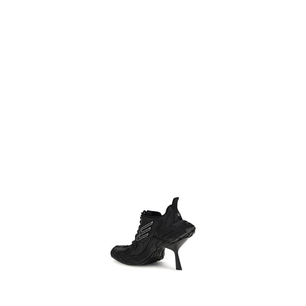 Monday Heel SneakersBalenciaga’s Monday Heel Sneakers are made of cowhide leather and polyester, featuring a curvature that gives a distinctive, modern design. The worn effect and exposed topstitching enhance the model’s lived-in, handcrafted aesthetic. T