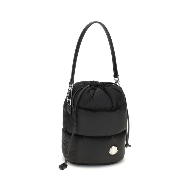 Black Polyester Backet BagMoncler’s Caradoc Bucket Bag is made of water-repellent nylon, with an inner lining of the same material for extra protection. Padded with down, it offers a practical drawstring closure. The leather shoulder strap is adjustable a