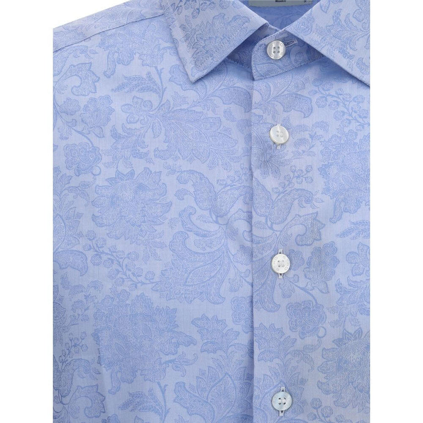 Light Blue Cotton Pattern ShirtCotton Roma Shirt by Etro featuring a classic collar, front button closure, adjustable button cuffs and iconic tone-on-tone paisley pattern. An elegant and refined garment for sophisticated style. Season: AW25 Fit: Regular C