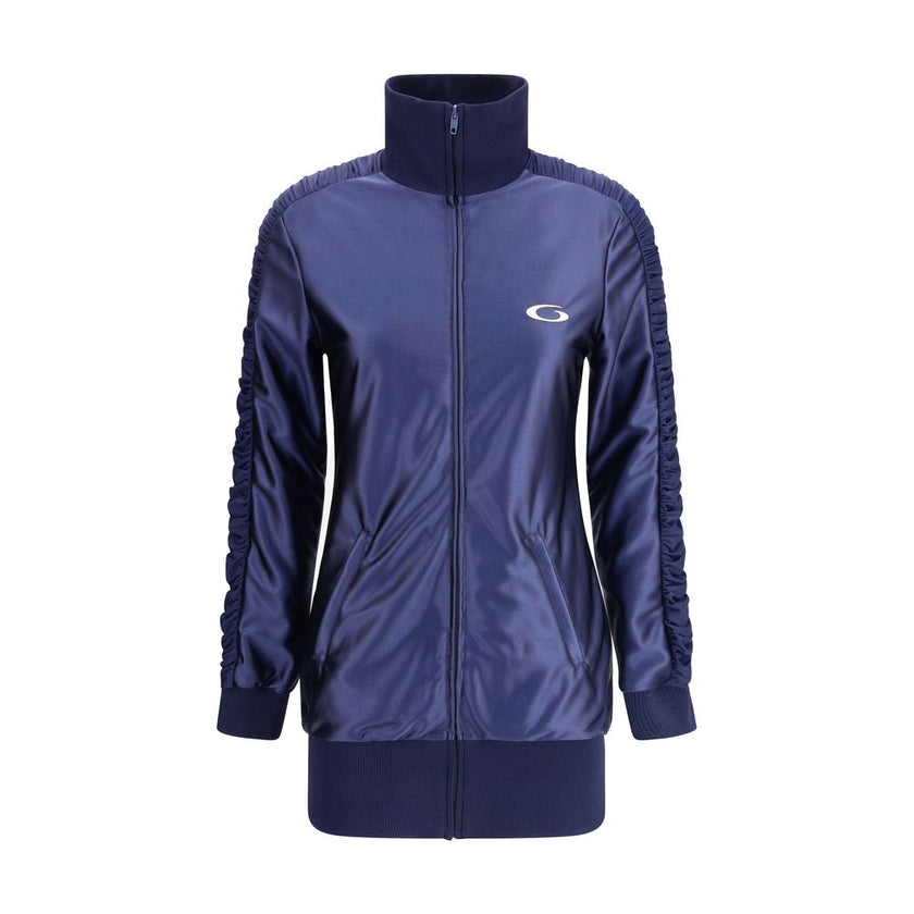 Blue Polyester SweatsuitBalenciaga’s shiny jersey fitted tracksuit Dress combines sportiness with refined style. Featuring a high collar and front zipper, it features a ruching band on the sleeves, two zippered pockets, gathers on the cuffs and waist, rib