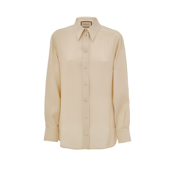 Beige Silk Pattern ShirtBeige Silk Shirt Horsebit Print Gucci. Classic collar, front fastening with fabric-covered buttons. Tone-on-tone stripes with allover horsebit print, rounded at the bottom. Composition: 100% Silk Internal SKU: 25GIU203 Brand SKU: 7