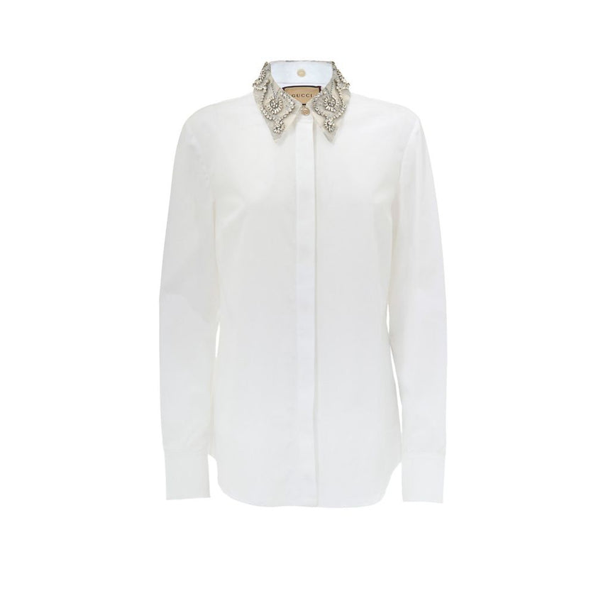 White Cotton Dress ShirtWhite Shirt with Removable Jewel Collar Gucci. Front fastening with covered buttons, long sleeves, removable classic collar covered with decorated tulle and crystals, Korean collar. Regular fit. Composition: 100% Cotton Internal SK