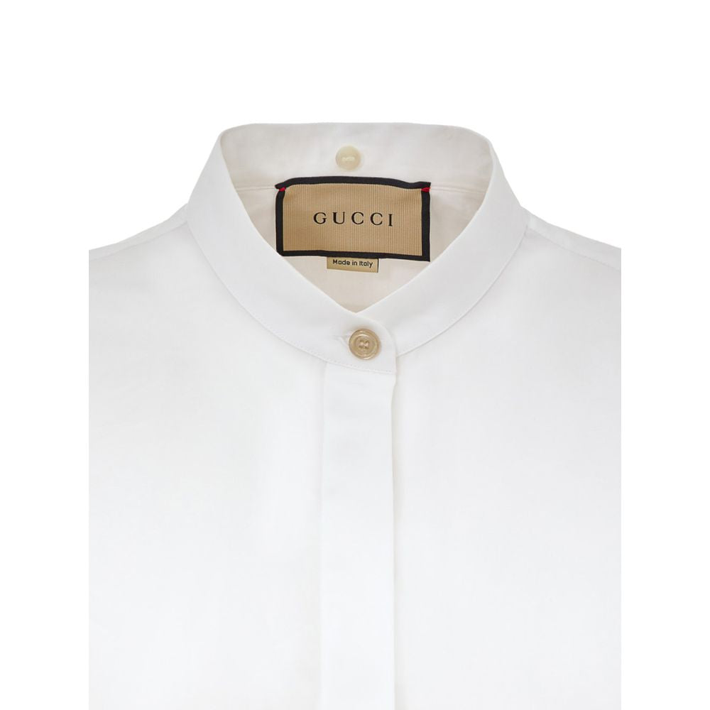 White Cotton Dress ShirtWhite Shirt with Removable Jewel Collar Gucci. Front fastening with covered buttons, long sleeves, removable classic collar covered with decorated tulle and crystals, Korean collar. Regular fit. Composition: 100% Cotton Internal SK