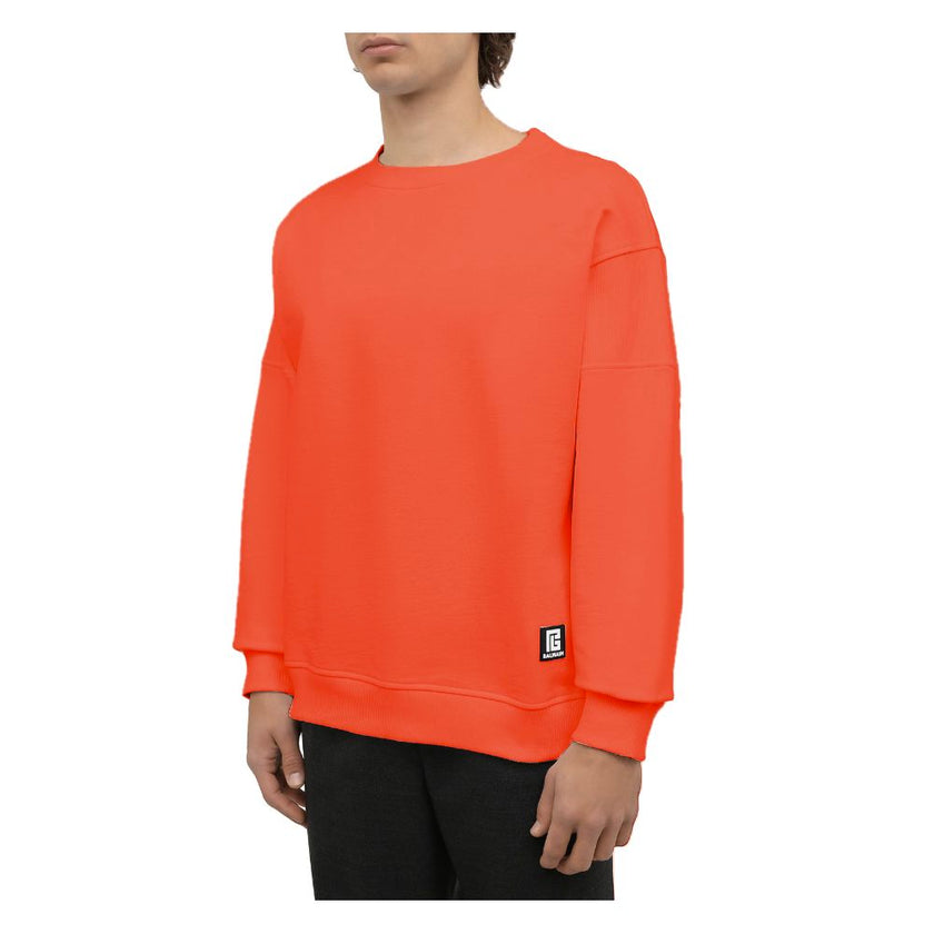 Orange Cotton Men SweaterElevate your style quotient with the Balmain cotton sweatshirt, where comfort meets high fashion. This bold orange piece showcases an audacious logo print on the back complemented by a striking rubber logo on the front, encapsulat