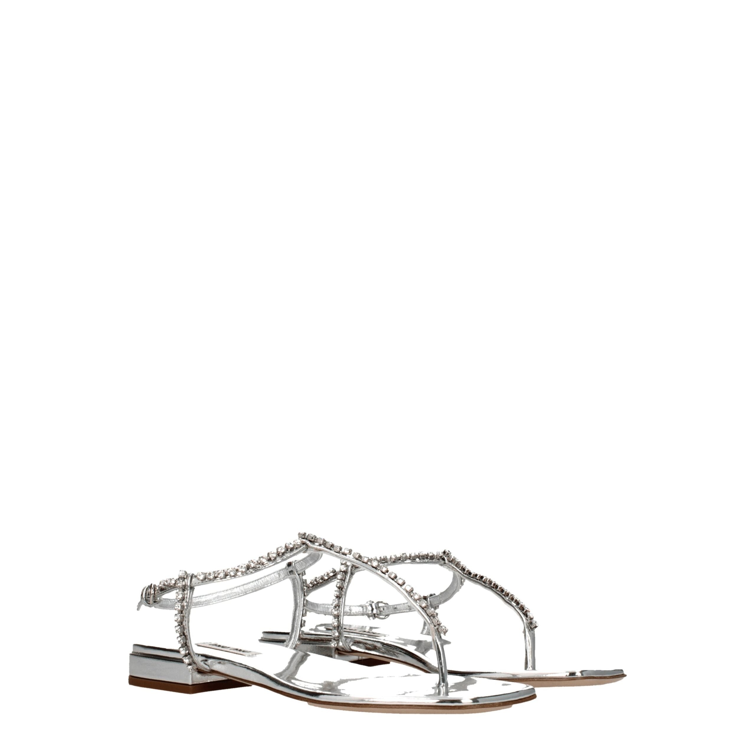 Gray Leather Flip-Flop SandalsDescription: The product with MPN 5Y920D3L1N010F0118 and code F76545 leather in silver is a flip flops designed by Miu Miu. It has features like metallic effect, rhinestone. Additional Info: Style: Stylish Closing type: Buckl