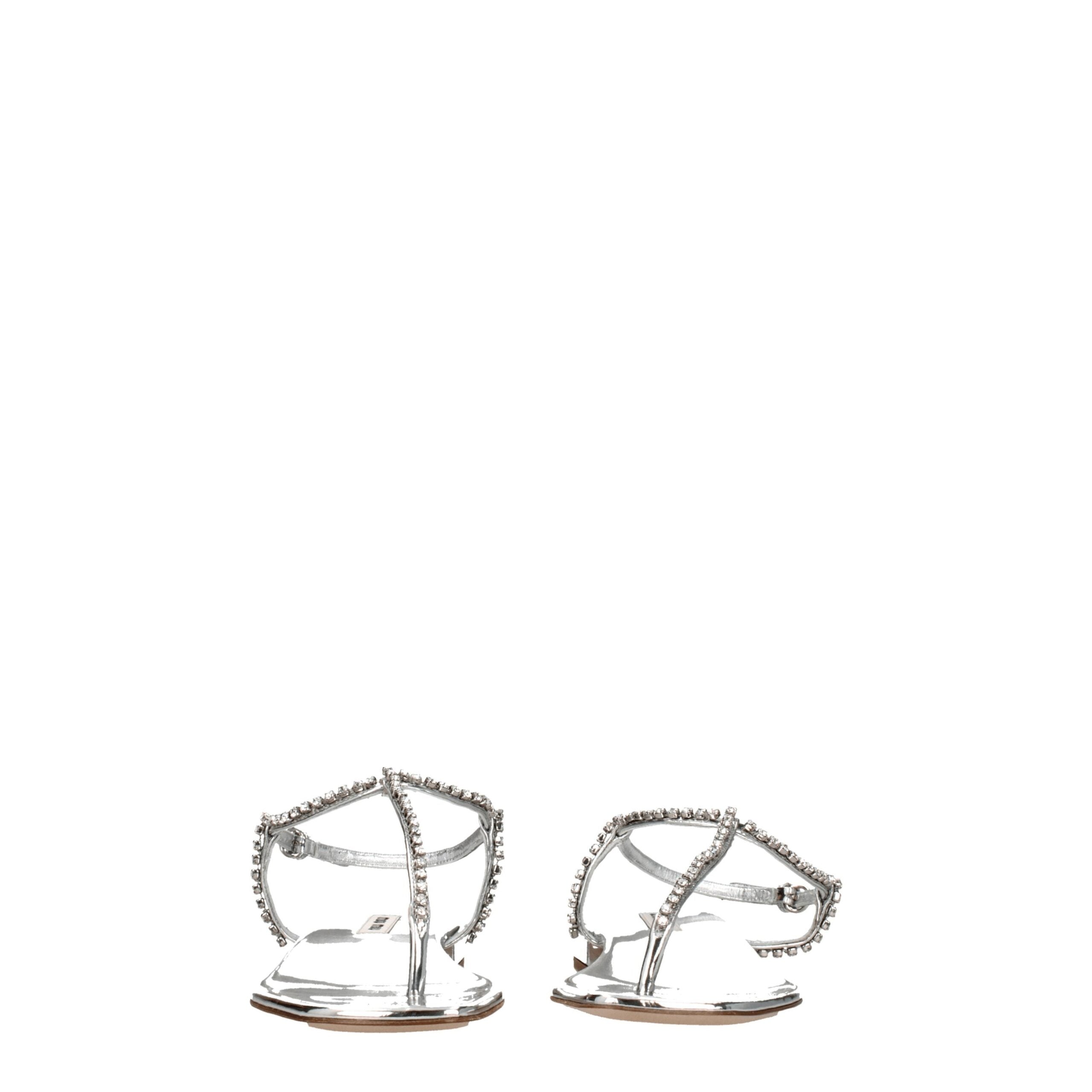 Gray Leather Flip-Flop SandalsDescription: The product with MPN 5Y920D3L1N010F0118 and code F76545 leather in silver is a flip flops designed by Miu Miu. It has features like metallic effect, rhinestone. Additional Info: Style: Stylish Closing type: Buckl