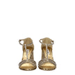 Gold Plastic Platform SandalsDescription: The product with MPN 5X732D3LKS100F0522 and code F76684 glitter in gold is a sandals designed by Miu Miu. It has features like rhinestone. Additional Info: Style: Stylish Closing type: Buckle Closure Materials: Le
