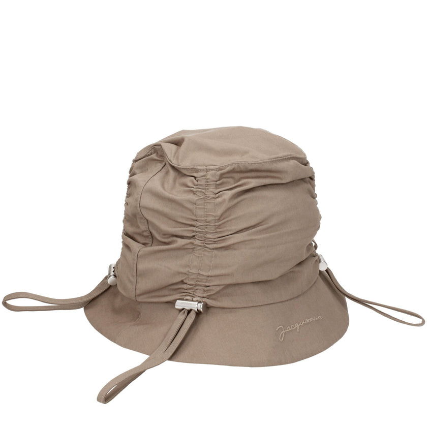 Beige Cotton Bucket HatDescription: The product with MPN 235AC4705047150 and code F76828 cotton in beige is a hats designed by Jacquemus. It has features like front logo. Additional Info: Color details: Silver Style: Casual Materials: Cotton Composition: