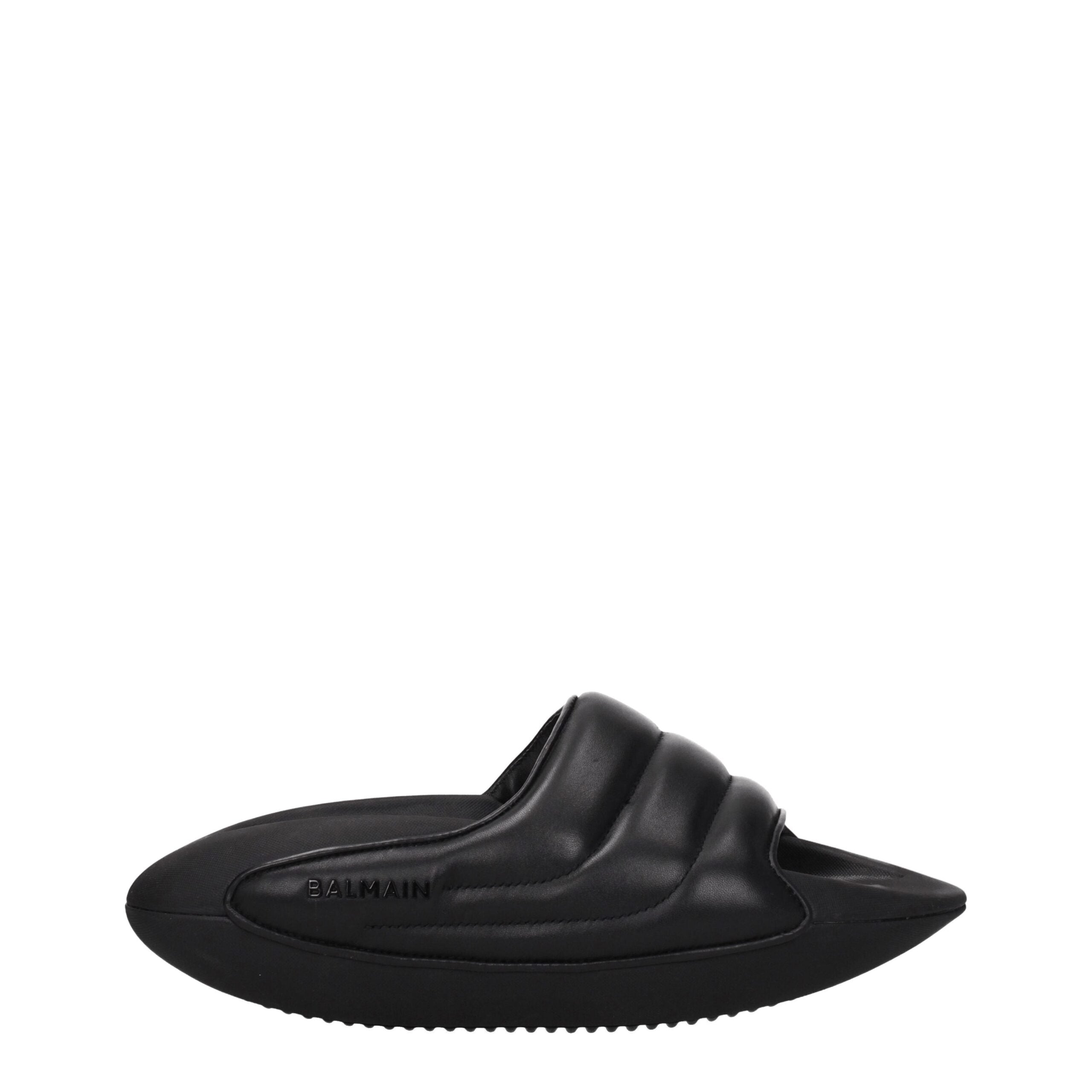 Black Leather SlippersDescription: The product with MPN VL299LPQP0PA and code F77106 leather in black is a slippers and clogs designed by Balmain. It has features like side logo. Additional Info: Style: Casual Materials: Leather Shoe sole: Rubber Heel hei