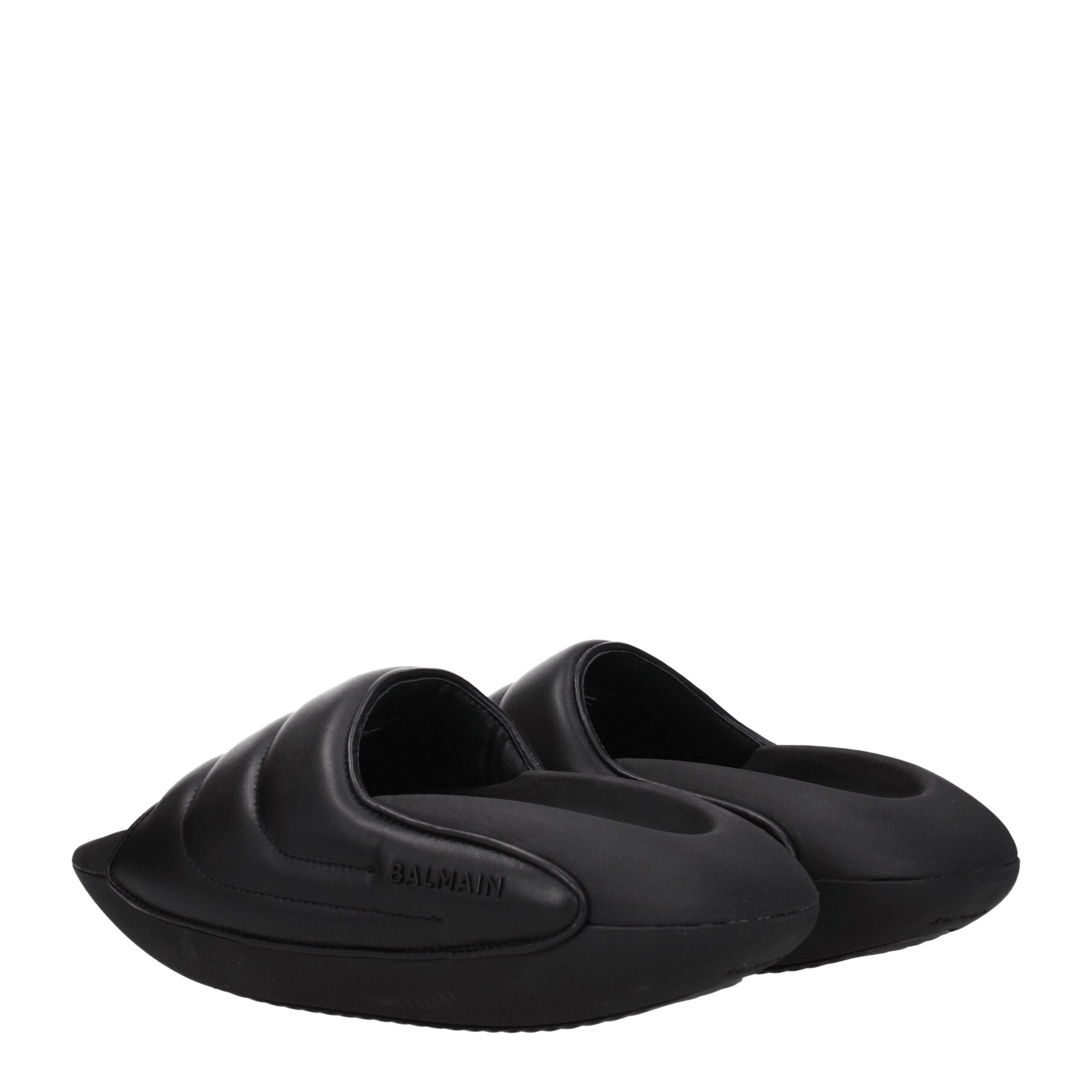 Black Leather SlippersDescription: The product with MPN VL299LPQP0PA and code F77106 leather in black is a slippers and clogs designed by Balmain. It has features like side logo. Additional Info: Style: Casual Materials: Leather Shoe sole: Rubber Heel hei