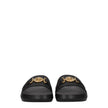 Black Leather SlippersDescription: The product with MPN 1011304DV46G1B00V and code F78143 leather in black is a slippers and clogs designed by Versace. It has features like front detail, back logo. Additional Info: Color details: Gold Style: Casual Materi