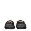 Black Leather SlippersDescription: The product with MPN 1010628DV46G1B00V and code F78140 leather in black is a slippers and clogs designed by Versace. It has features like back logo. Additional Info: Color details: Gold Style: Casual Materials: Leather S