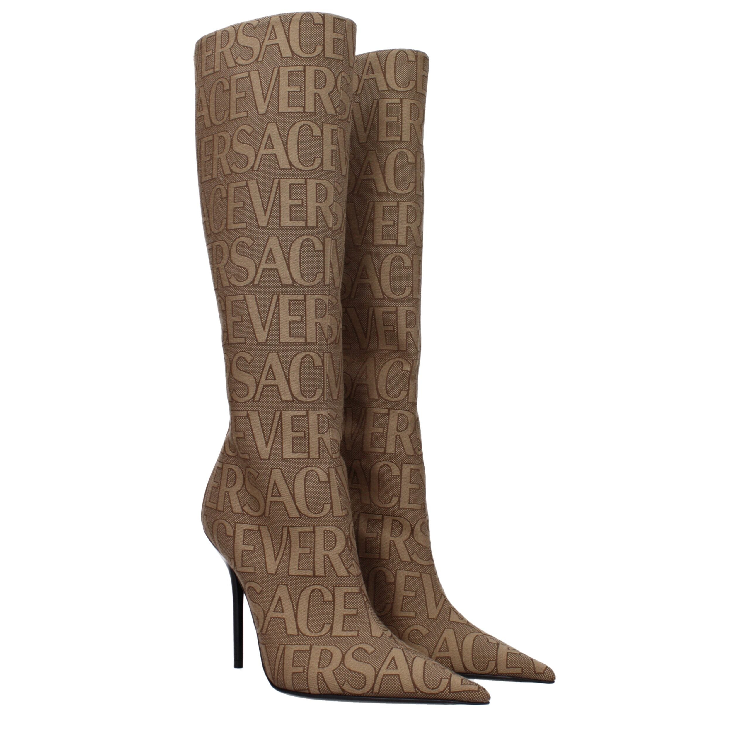 Beige Fabric High Heel BootsDescription: The product with MPN 10113981A079772N24P and code F80012 fabric in beige is a boots designed by Versace. It has features like logo. Additional Info: Style: Casual Closing type: Zip Closure Materials: Fabric Shoe so