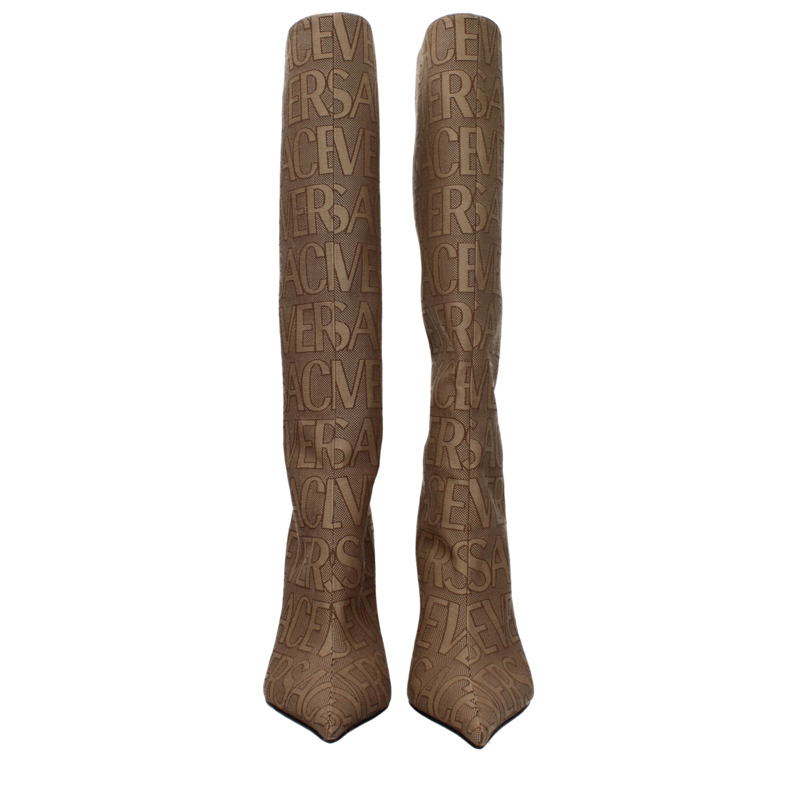 Beige Fabric High Heel BootsDescription: The product with MPN 10113981A079772N24P and code F80012 fabric in beige is a boots designed by Versace. It has features like logo. Additional Info: Style: Casual Closing type: Zip Closure Materials: Fabric Shoe so