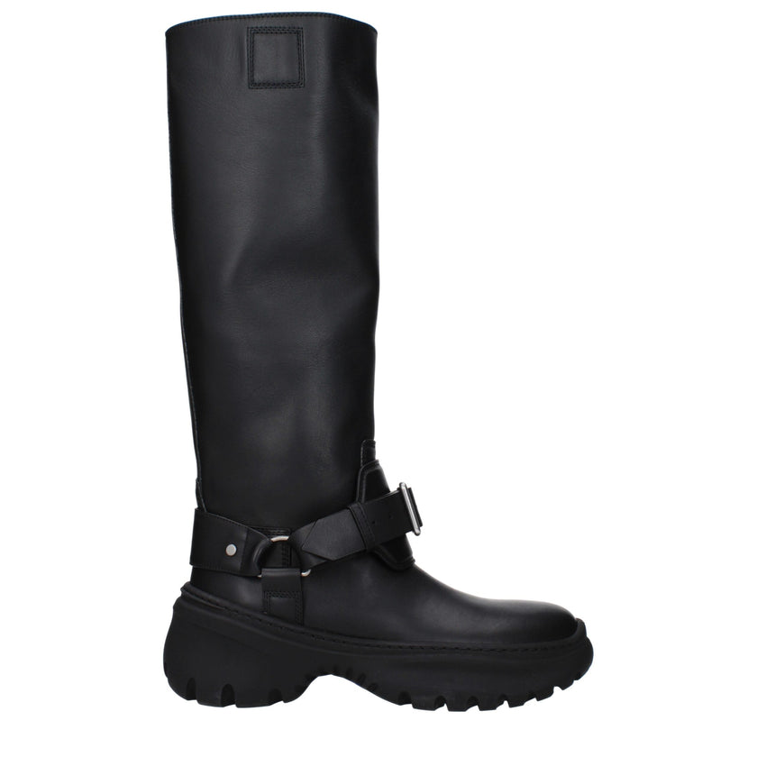 Black Leather BootsDescription: The product with MPN 8096904 and code F82616 leather in black is a boots designed by Burberry. It has features like front detail, vintage effect. Additional Info: Color details: Silver Style: Casual Materials: Leather Shoe