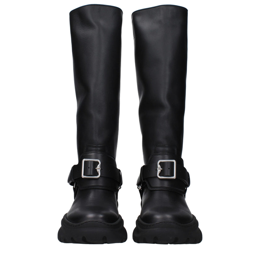 Black Leather BootsDescription: The product with MPN 8096904 and code F82616 leather in black is a boots designed by Burberry. It has features like front detail, vintage effect. Additional Info: Color details: Silver Style: Casual Materials: Leather Shoe