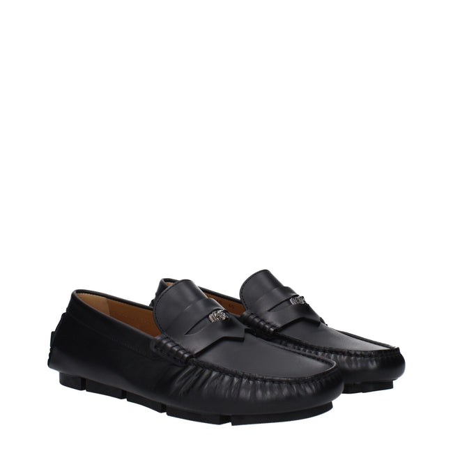 Black Leather Slip-On LoafersDescription: The product with MPN 10139601A006931B00E and code F82958 leather in black is a loafers designed by Versace. It has features like back logo, front detail. Additional Info: Color details: Gold Style: Stylish Materia