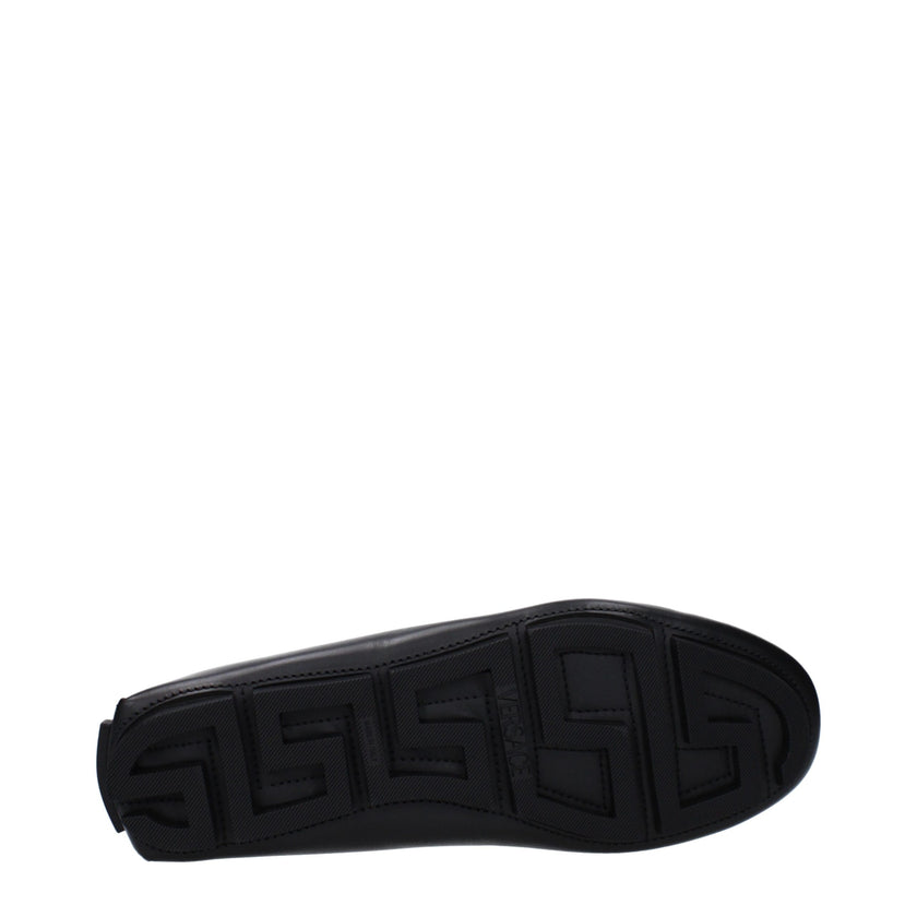 Black Leather Slip-On LoafersDescription: The product with MPN 10139601A006931B00E and code F82958 leather in black is a loafers designed by Versace. It has features like back logo, front detail. Additional Info: Color details: Gold Style: Stylish Materia