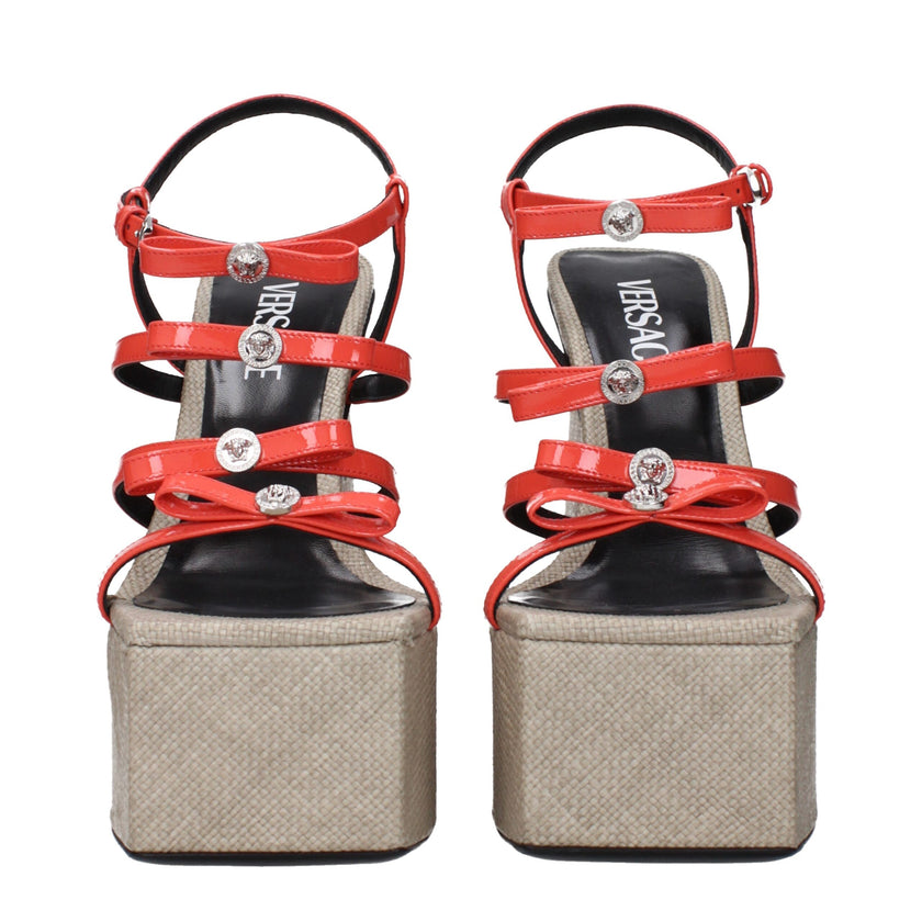 Orange Leather Platform SandalsDescription: The product with MPN 10154281A109841RA8P and code F83438 patent leather in orange is a sandals designed by Versace. It has features like front logo.Orange Leather Platform Sandals${tagsVersaceAulae Orange Leathe