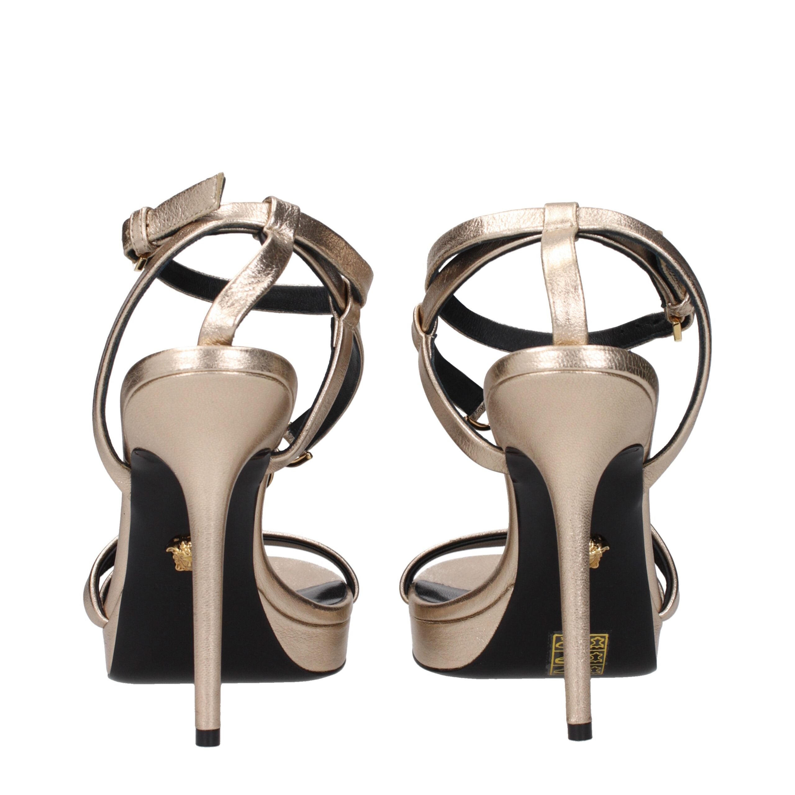 Gold Leather Stiletto Heel SandalsDescription: The product with MPN 10121341A085391Y84V and code F83763 leather in gold is a sandals designed by Versace. It has features like front logo. Additional Info: Style: Casual Closing type: Buckle Closure Shoe sol