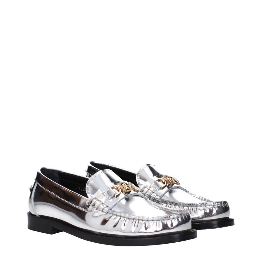 Gray Leather Slip-On LoafersDescription: The product with MPN 10121231A043021E01V and code F83780 leather in silver is a loafers designed by Versace. It has features like front logo, metallic effect. Additional Info: Style: Casual Shoe sole: Leather Shoe