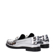 Gray Leather Slip-On LoafersDescription: The product with MPN 10121231A043021E01V and code F83780 leather in silver is a loafers designed by Versace. It has features like front logo, metallic effect. Additional Info: Style: Casual Shoe sole: Leather Shoe