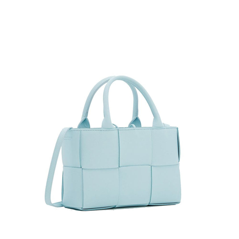 Blue Lamb Leather Tote BagDescription: – Composition: 100% Lamb Leather – Two top handles – Internal leather pouch – Unlined – Brand’s signature Intrecciato weave – Closed with drawcords – Made in Italy – Gender: WOMEN – Size & Fit: Height 16,5cm, Lenght