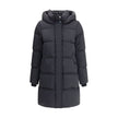 Black Goose Down CoatThe Kelly Down Jacket by Woolrich combines practicality and contemporary style. Featuring elastic cuffs and a hood, it features a front zipper and button closure, zippered side slits and two welt pockets. The padded and quilted design