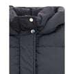 Black Goose Down CoatThe Kelly Down Jacket by Woolrich combines practicality and contemporary style. Featuring elastic cuffs and a hood, it features a front zipper and button closure, zippered side slits and two welt pockets. The padded and quilted design