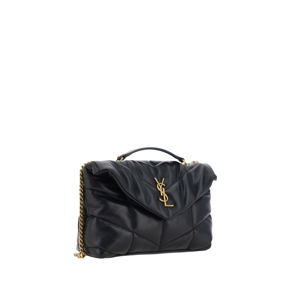 Black Lamb Ovis Aries Aries Shoulder BagThe Puffer Toy Shoulder Bag by Saint Laurent is a compact and luxurious accessory perfect for completing elegant looks with a contemporary twist. Made of soft lambskin leather, it features a padded design with all-o