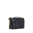 Black Lamb Ovis Aries Aries Shoulder BagThe Puffer Toy Shoulder Bag by Saint Laurent is a compact and luxurious accessory perfect for completing elegant looks with a contemporary twist. Made of soft lambskin leather, it features a padded design with all-o