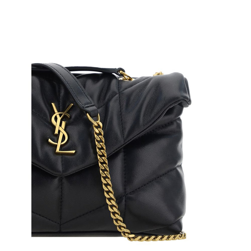 Black Lamb Ovis Aries Aries Shoulder BagThe Puffer Toy Shoulder Bag by Saint Laurent is a compact and luxurious accessory perfect for completing elegant looks with a contemporary twist. Made of soft lambskin leather, it features a padded design with all-o