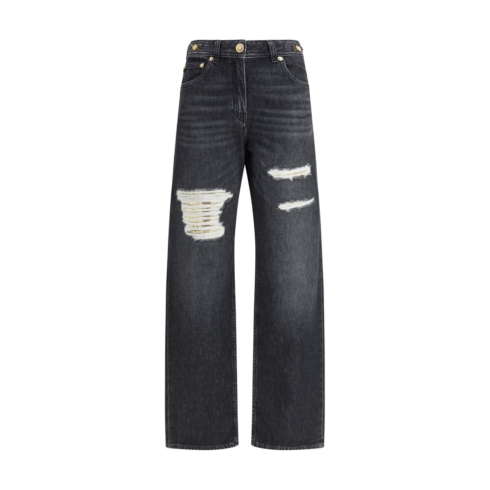 Black Cotton Relaxed Fit JeansMid-rise Jeans by Versace, made of pure cotton and featuring a five-pocket design. The model is distinguished by cut-out details on the front, embellished with applied gold metallic mesh inserts, which add a bold and contempo
