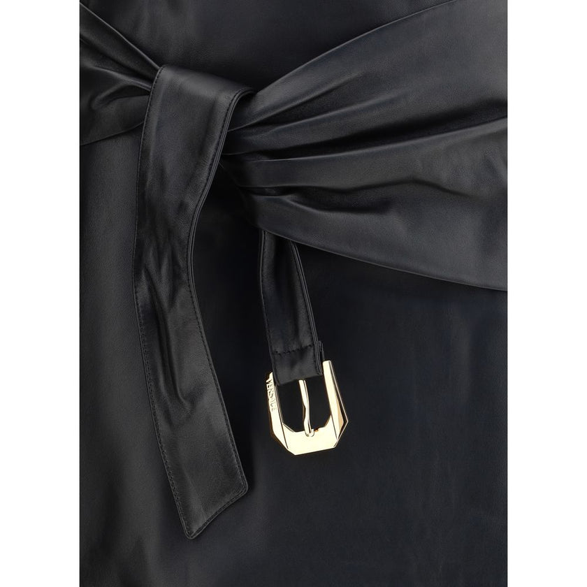 Black Lamb Ovis Aries Aries Mini SkirtThe Versace lambskin Miniskirt is a bold and sophisticated piece, enriched by an elegant decorative knot on the front that adds dynamism to the design. Crafted from soft leather, it features a zip fastening on the bac