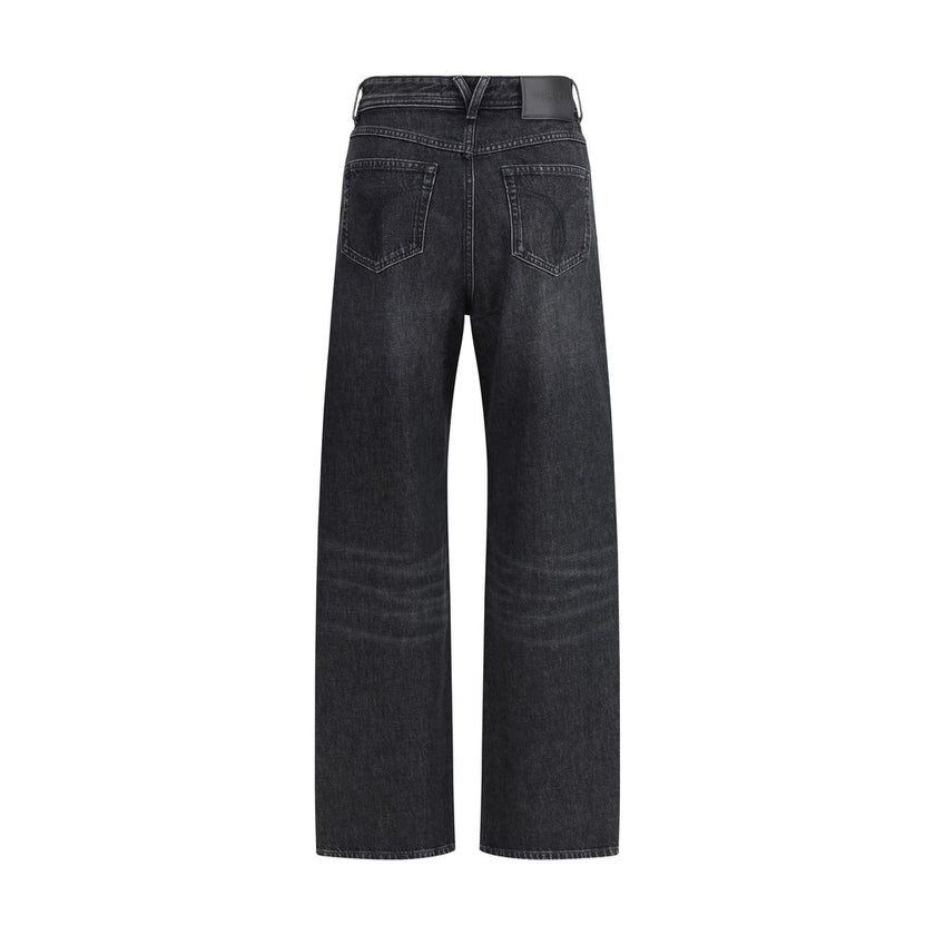 Black Cotton Relaxed Fit JeansMid-rise Jeans by Versace, made of pure cotton and featuring a five-pocket design. The model is distinguished by cut-out details on the front, embellished with applied gold metallic mesh inserts, which add a bold and contempo