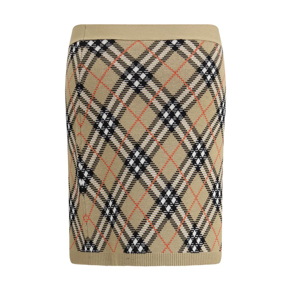 Beige Wool Mini SkirtBurberry’s wool-blend Miniskirt features refined Burberry Check embroidery that covers the entire surface, lending a touch of timeless elegance. The elastic waist ensures comfort and fit, while the ribbed hem adds a stylish detail. Un