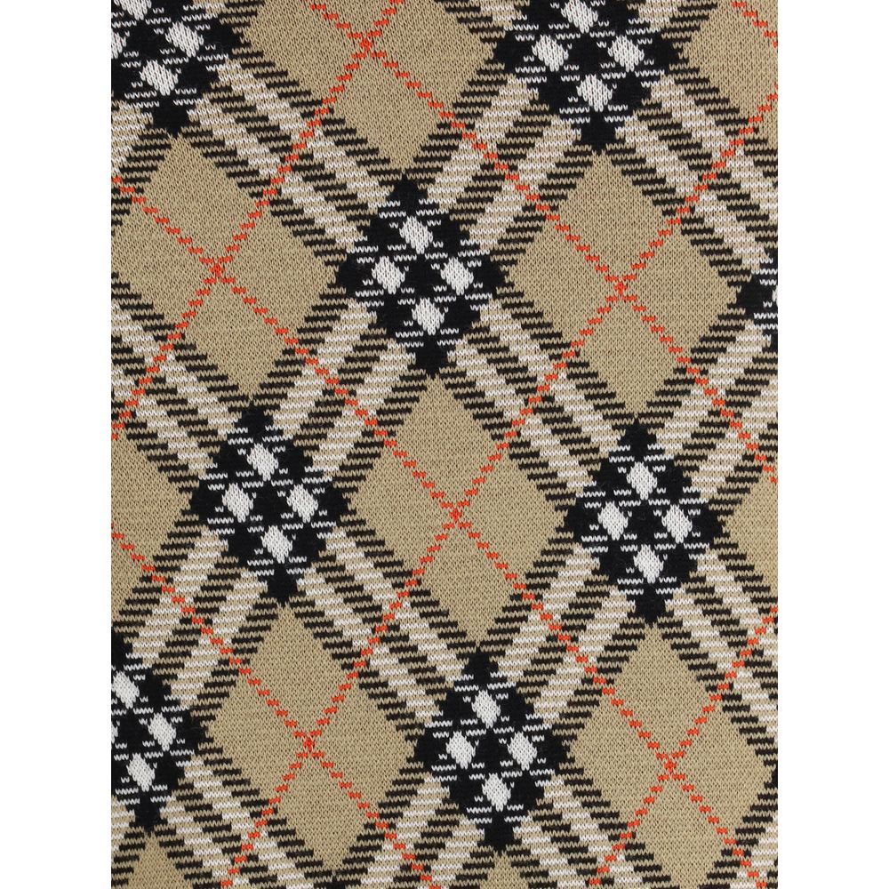 Beige Wool Mini SkirtBurberry’s wool-blend Miniskirt features refined Burberry Check embroidery that covers the entire surface, lending a touch of timeless elegance. The elastic waist ensures comfort and fit, while the ribbed hem adds a stylish detail. Un