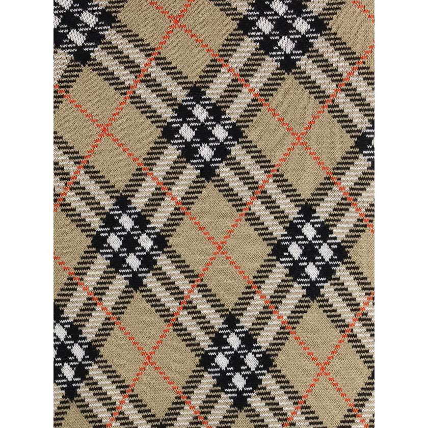 Beige Wool Mini SkirtBurberry’s wool-blend Miniskirt features refined Burberry Check embroidery that covers the entire surface, lending a touch of timeless elegance. The elastic waist ensures comfort and fit, while the ribbed hem adds a stylish detail. Un