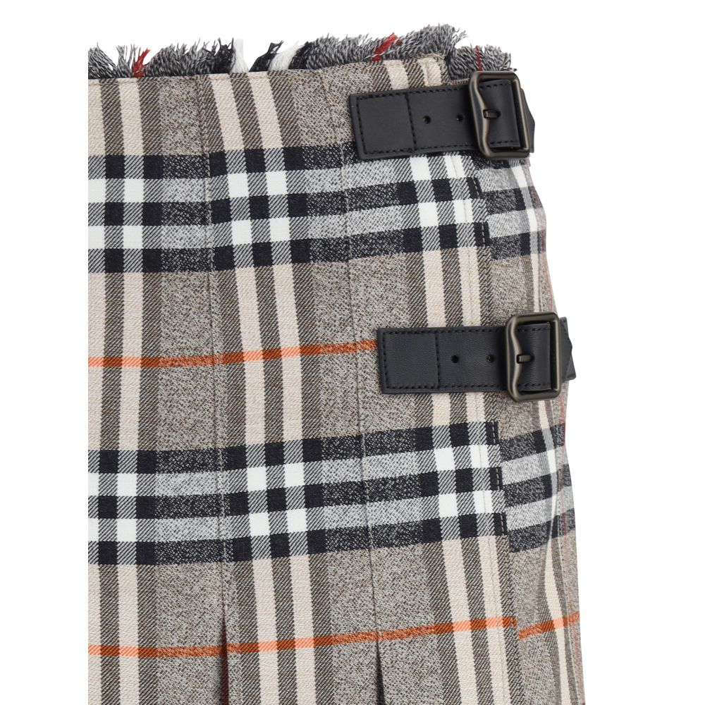 Gray Wool Mini SkirtBurberry’s Check Archive Wool Miniskirt features a flared silhouette with pleats that give it movement and femininity. The waist is finished with short, thin bangs, while leather straps with a B-shaped buckle allow for tailored adjustm