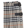 Gray Wool Mini SkirtBurberry’s Check Archive Wool Miniskirt features a flared silhouette with pleats that give it movement and femininity. The waist is finished with short, thin bangs, while leather straps with a B-shaped buckle allow for tailored adjustm