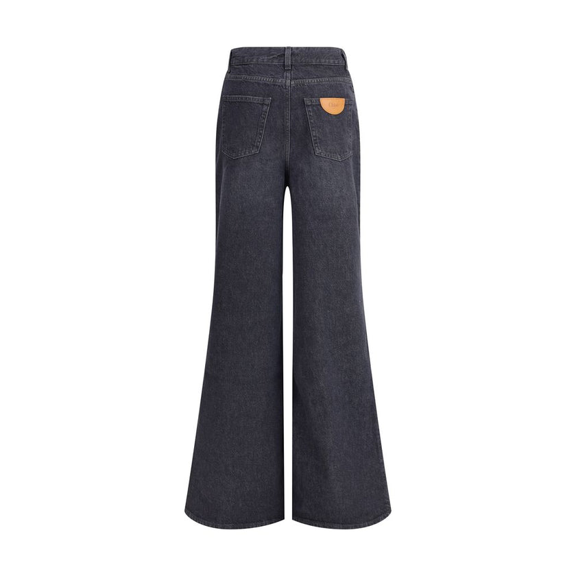 Black Cotton Flared JeansPure cotton five-pocket Jeans by Chloé feature a front zip-and-button closure. The mid-rise style has belt loops at the waist and features a logo leather patch applied at the back. An essential garment with a versatile design, ide