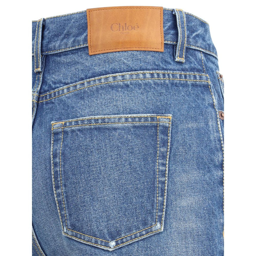 Blue Cotton Flared JeansChloé’s Flare Jeans are an iconic garment that reinterprets a classic with a touch of contemporary elegance. Featuring a traditional five-pocket pattern, they offer functionality and timeless style. The high waist slims the figure