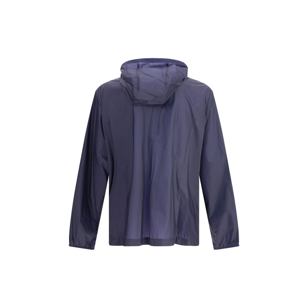 Blue Nylon Shell JacketMoncler x Gilga Farm di Donald Glover Hamlin waterproof Jacket made of ripstop nylon, a highly resistant and water-repellent technical fabric, perfect for tackling variable weather conditions. It features a high collar with adjustab