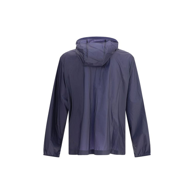Blue Nylon Shell JacketMoncler x Gilga Farm di Donald Glover Hamlin waterproof Jacket made of ripstop nylon, a highly resistant and water-repellent technical fabric, perfect for tackling variable weather conditions. It features a high collar with adjustab