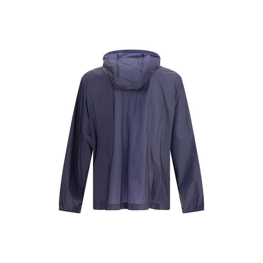 Blue Nylon Shell JacketMoncler x Gilga Farm di Donald Glover Hamlin waterproof Jacket made of ripstop nylon, a highly resistant and water-repellent technical fabric, perfect for tackling variable weather conditions. It features a high collar with adjustab