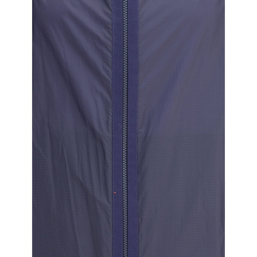 Blue Nylon Shell JacketMoncler x Gilga Farm di Donald Glover Hamlin waterproof Jacket made of ripstop nylon, a highly resistant and water-repellent technical fabric, perfect for tackling variable weather conditions. It features a high collar with adjustab