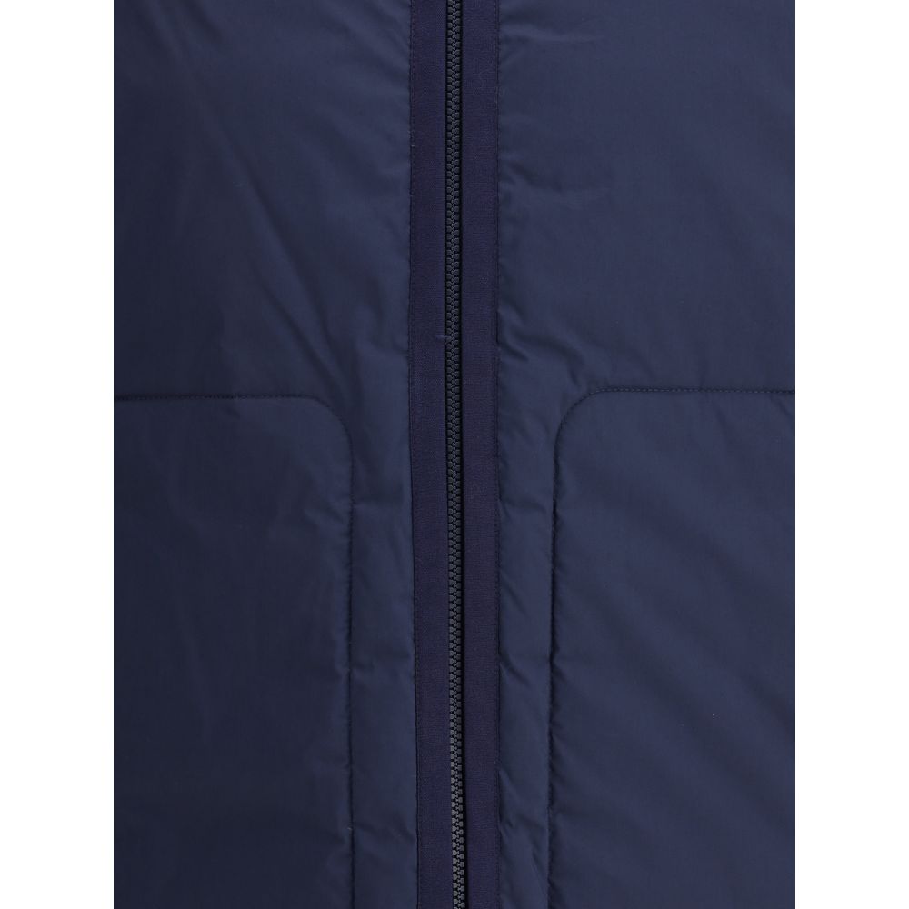 Blue Goose Down Full-Length JacketThe Moncler x Gilga Farm Caracara short Down Jacket by Donald Glover combines elegance and functionality. Crafted from a lightweight cotton and nylon blend, it features hidden boudin quilting, an adjustable drawstring hoo