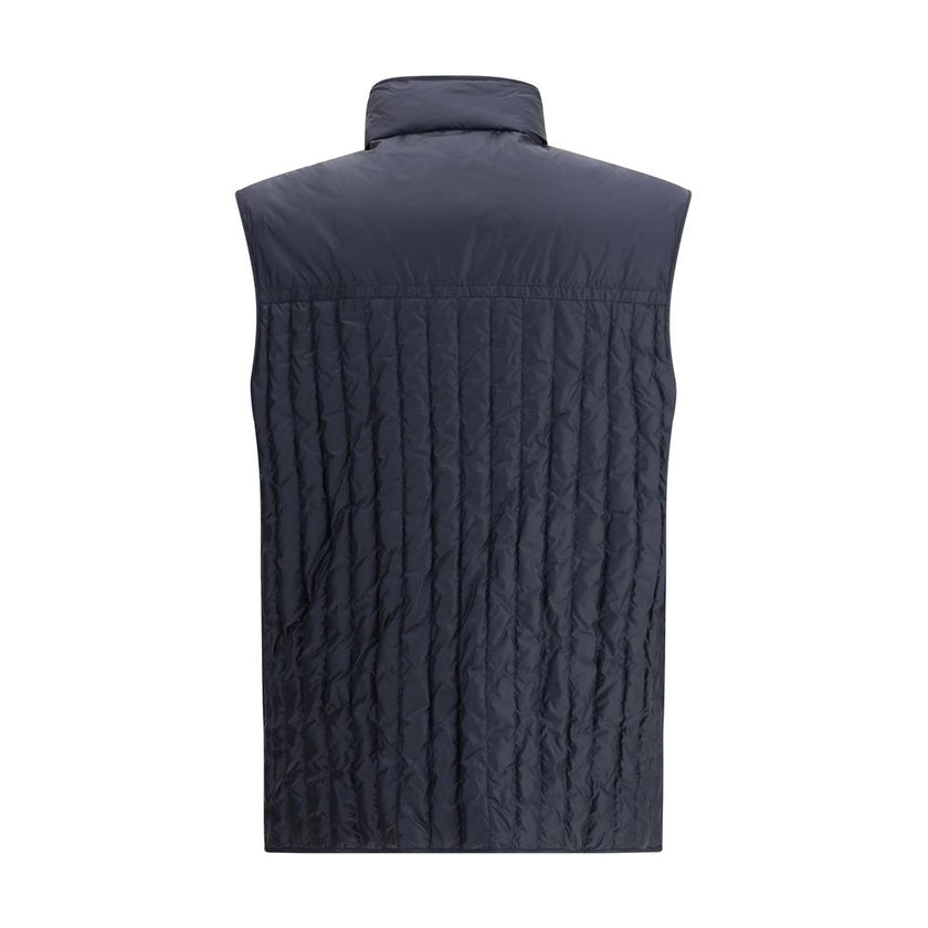 Blue Polyamide Sleveless JacketThe Moncler x Gilga Farm Down Vest by Donald Glover, named Tangerine after the orange groves of Gilga Farm, combines lightness and functionality. Crafted from longue saison, a lightweight and protective nylon, it features wa